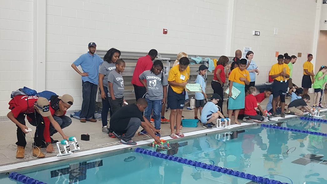 STEAMsport, Inc. students putting their ROV in the water 2